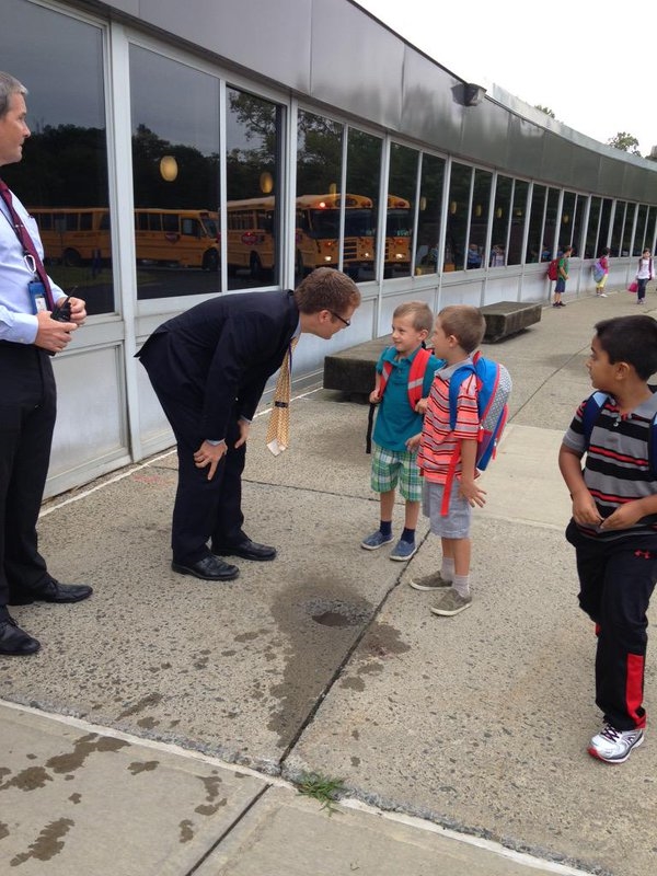 Principal Thiell greets new kingergarten students on their first day of school