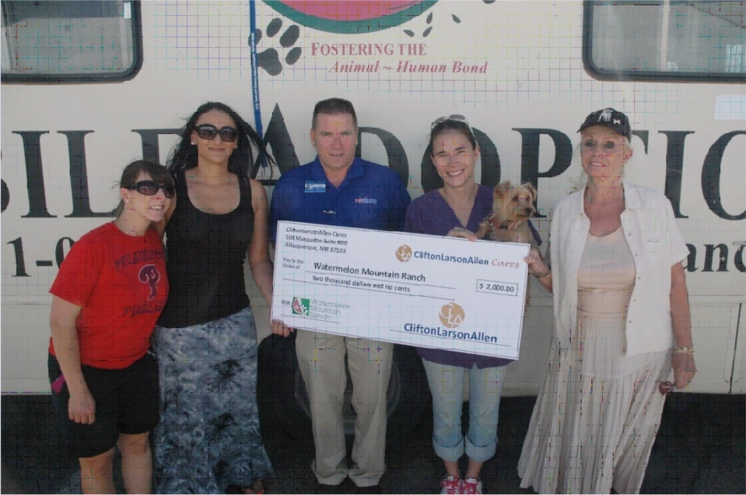 Members of CLA Albuquerque present Watermelon Mountain Ranch with a $2,000 donation.  CLA Albuquerque and it's employees donated over $100,000 to the New Mexico Community in 2013