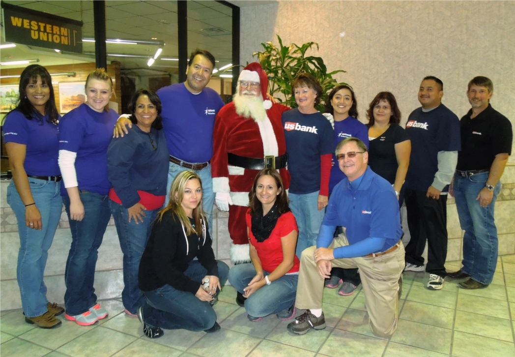 US Bank employees from Las Cruces (and Santa) preparing to work on the Las Cruces Coats for Kids project.