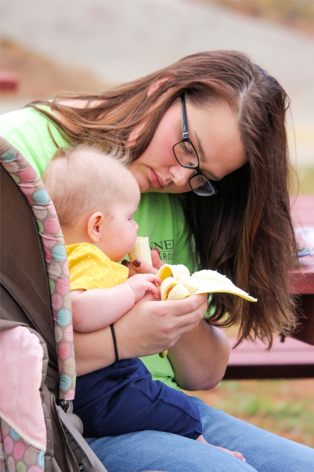 A team member shares her snack during the Team Tanner Family Day event in September at John Tanner Park near Carrollton. 