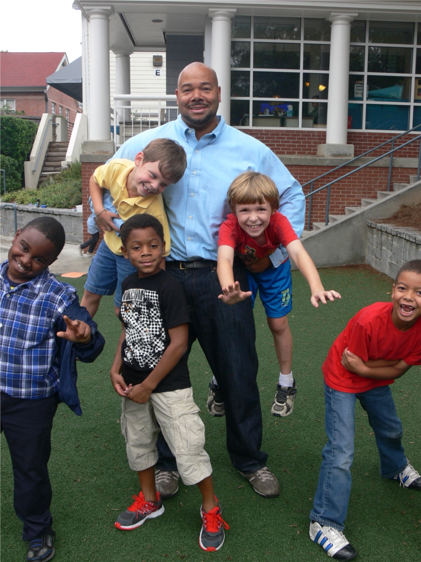 The Children's School has a talented and dedicated teaching staff and low student-teacher ratios at every grade level. Here some second grades goof around with their teacher during recess. 