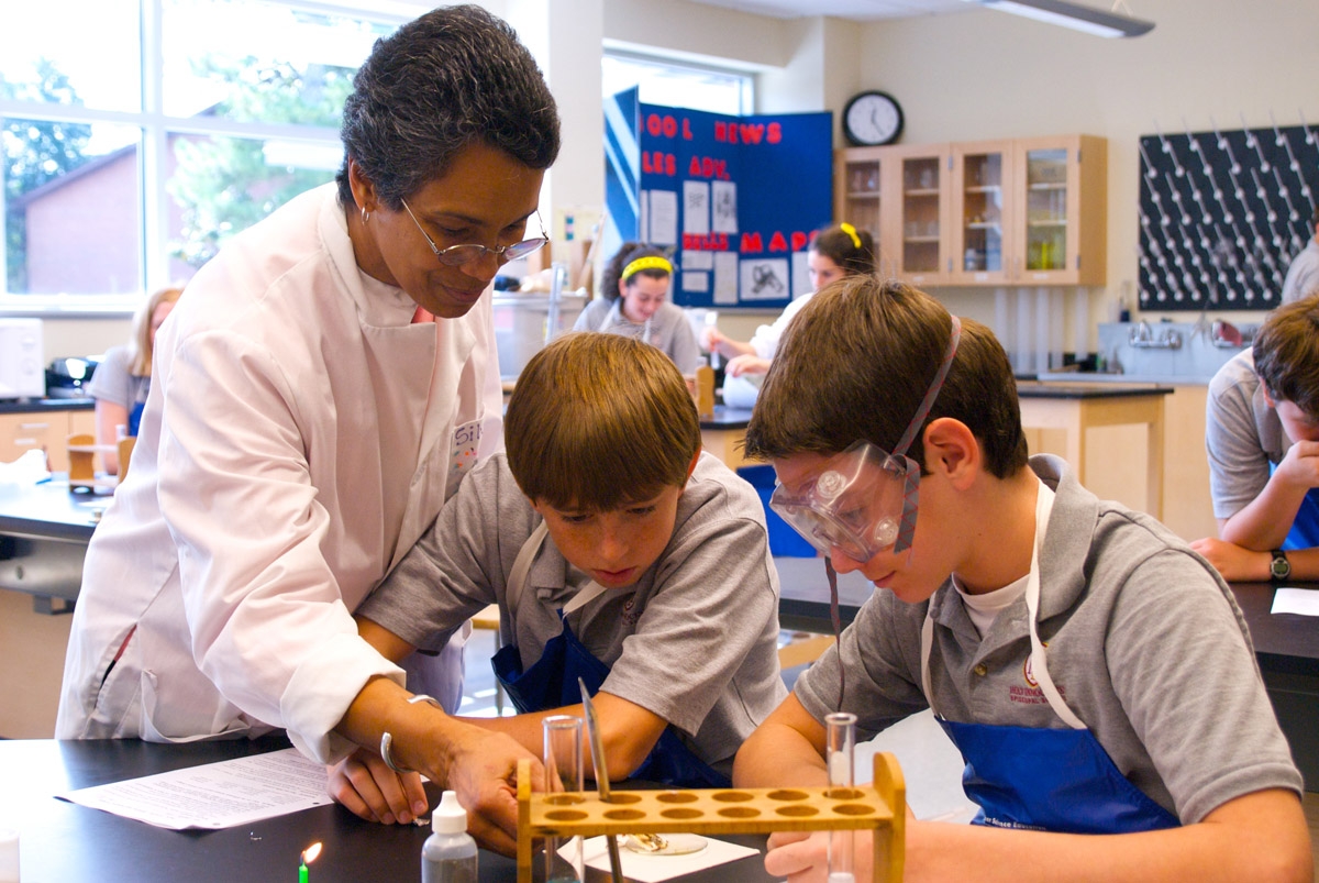 Science teacher and Science Olympiad advisor Janet Silvera with students in the Rowan Family Middle School.