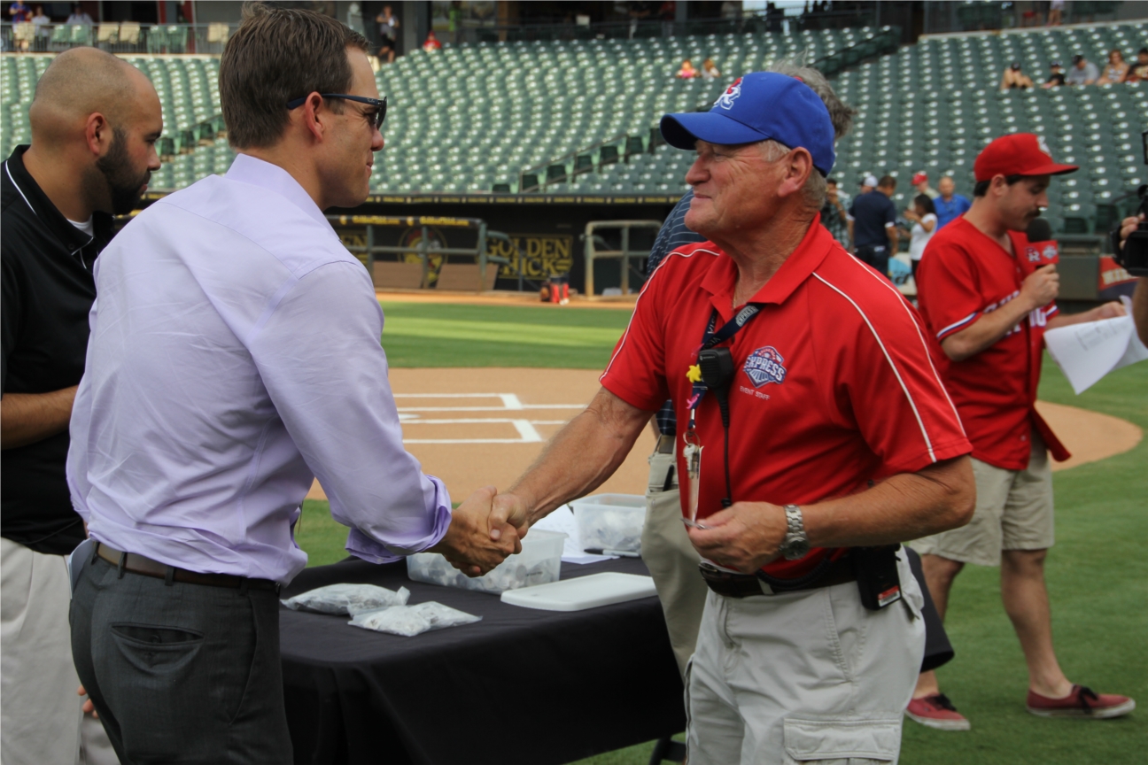 Round Rock Express CEO Reese Ryan congratulates Game Day Employee Supervisor Tim Allen on five years of service during the team's annual pregame Employee Pin Ceremony, recognizing 5, 10, and 15 Year Employees, both full time and part time.