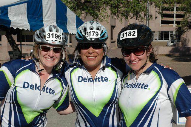 Three of Deloitte's MS150 participants pose for the camera