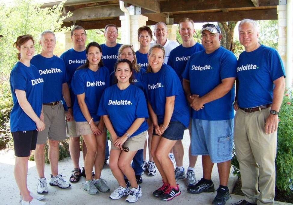 Deloitte professionals pose at a Wounded Warriors event