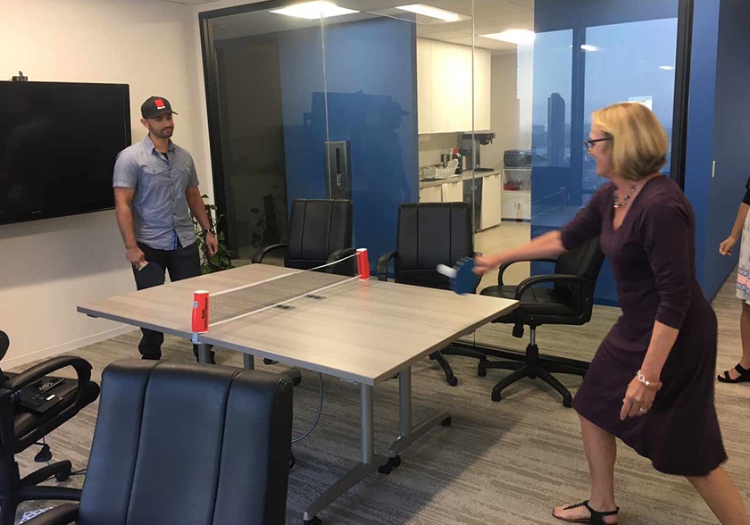 CEO Lisa takes on a challenger in table tennis.