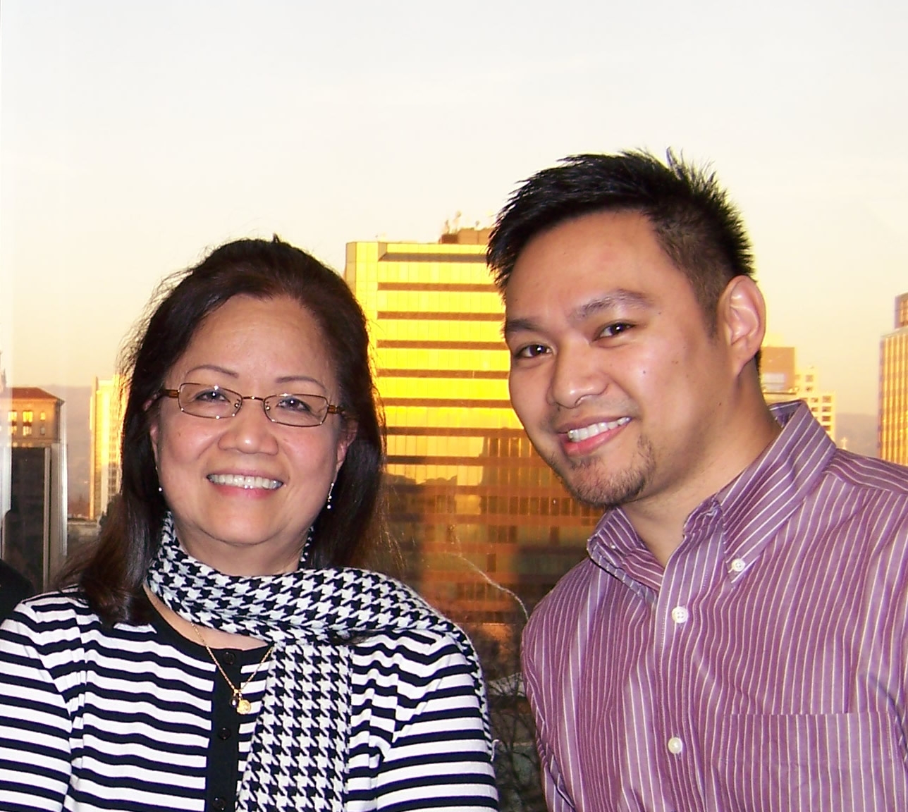 Bridge Bank employees at an after hours celebration at Bridge Bank headquarters, overlooking the downtown San Jose cityscape.