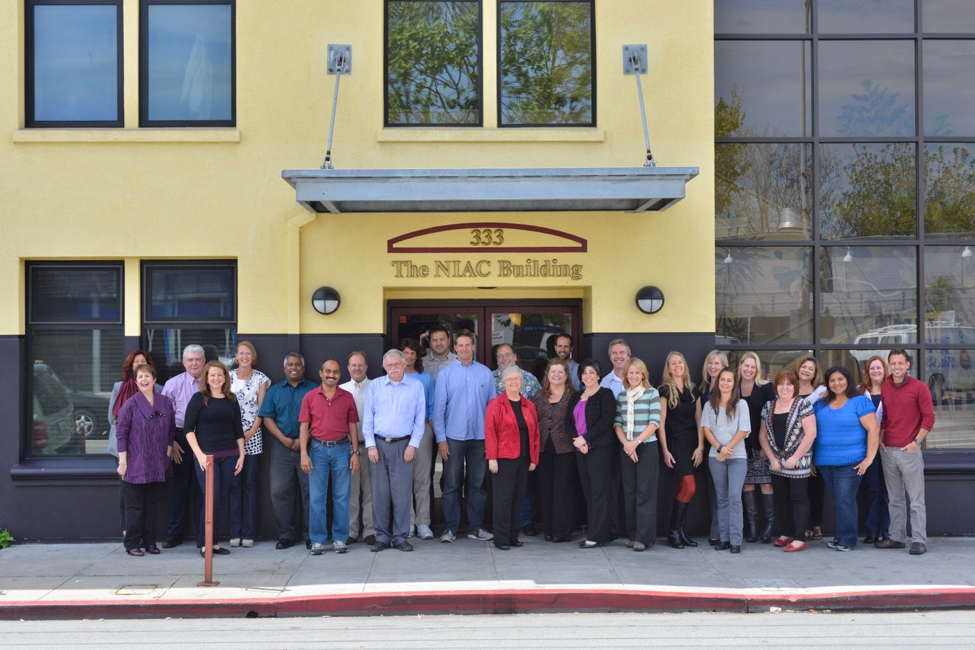 The staff of The Nonprofit Insurance Alliance Group outside our Main Office in Santa Cruz, CA.