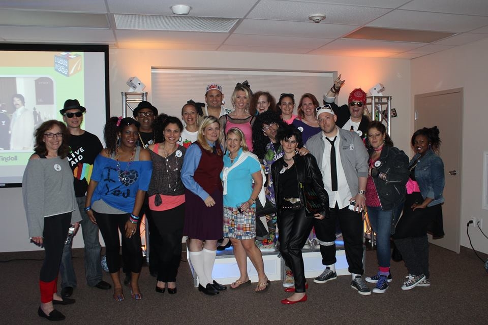 Employees get in the spirit during AquilentLive! 80s edition.