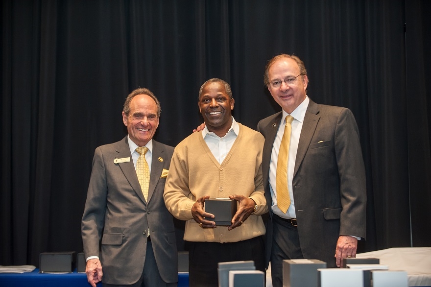 David Hillman, CEO and Ron T. Frank, President presenting a tenure award to Mike Rivers at the Annual Awards Banquet.