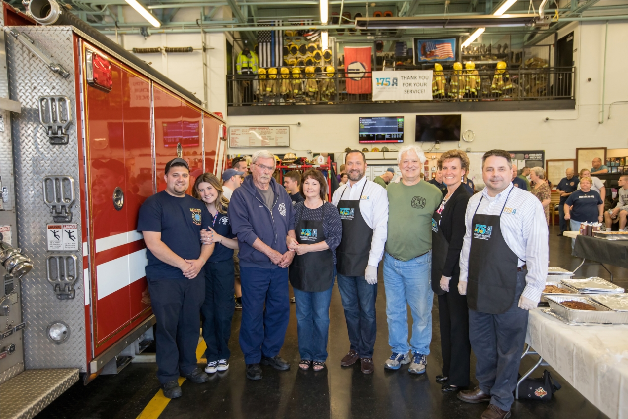 President/CEO Steve Linkous along with other employee volunteers serve dinner to the Bel Air fire station.