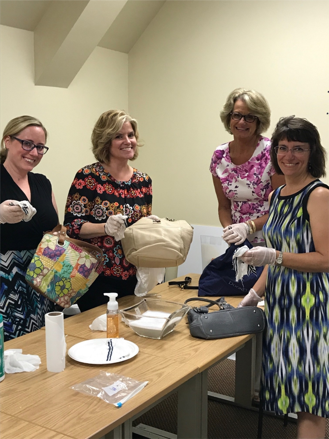Volunteer employees collected and cleaned donated purses to help with the annual Purse Sale to benefit Harford Family House and support homeless families in Harford County.
