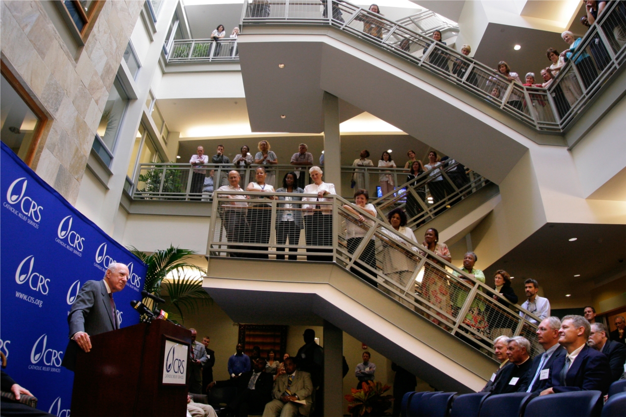 CRS employees gather for a celebration of the building's LEED status.  The center atrium opens between three stories of the former Stewart's Department store building, now the worldwide headquarters of Catholic Relief Services. Photo credit: Jim Stipe/CRS