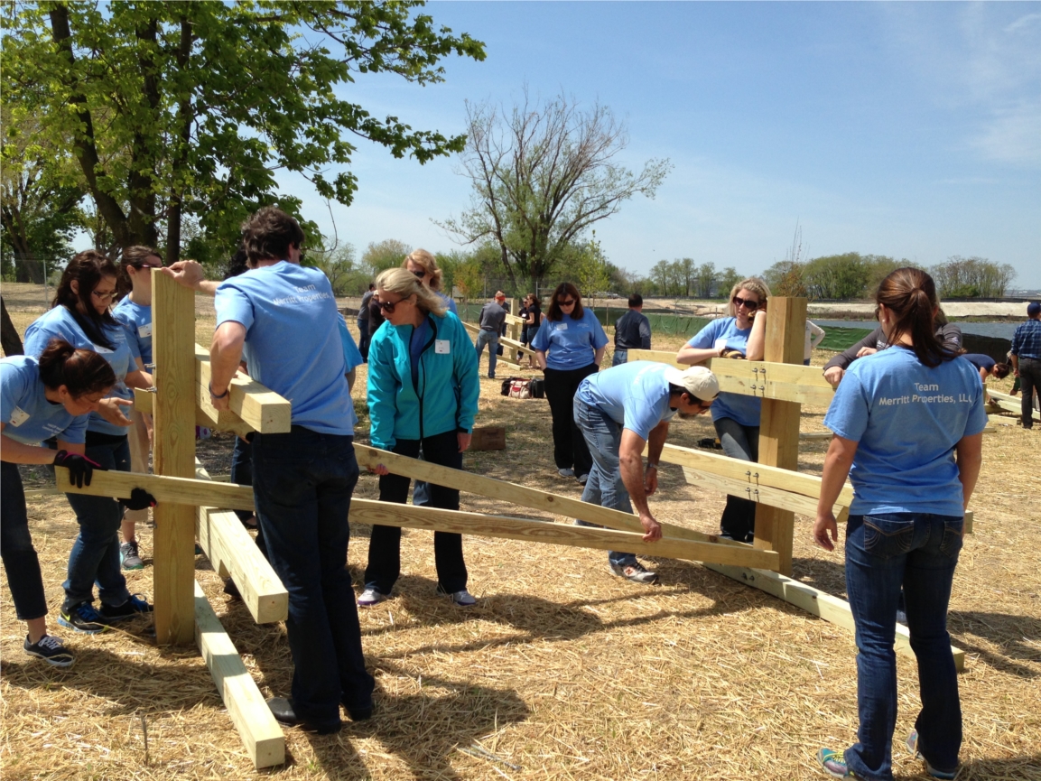 Team Merritt building a canoe rack at NAOIP Maryland's 2013 Community Service Day with Living Classrooms.