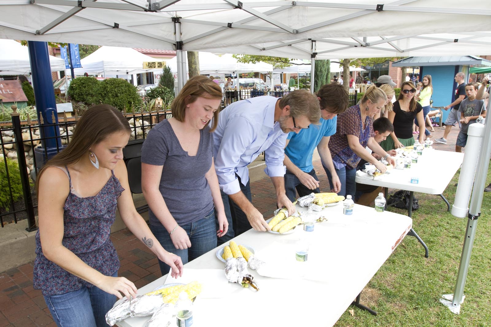 During the annual CornFest event, Fahlgren Mortine team members head over to the Easton Farmer's Market to see who can eat three ears of corn the fastest. The victor gets the honor of being the CornFest champ for the year, and the coveted golden corn holders.