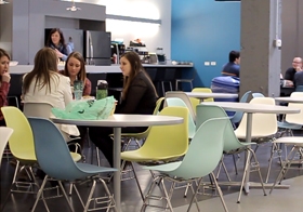 Employees catch up in the spacious cafe.  