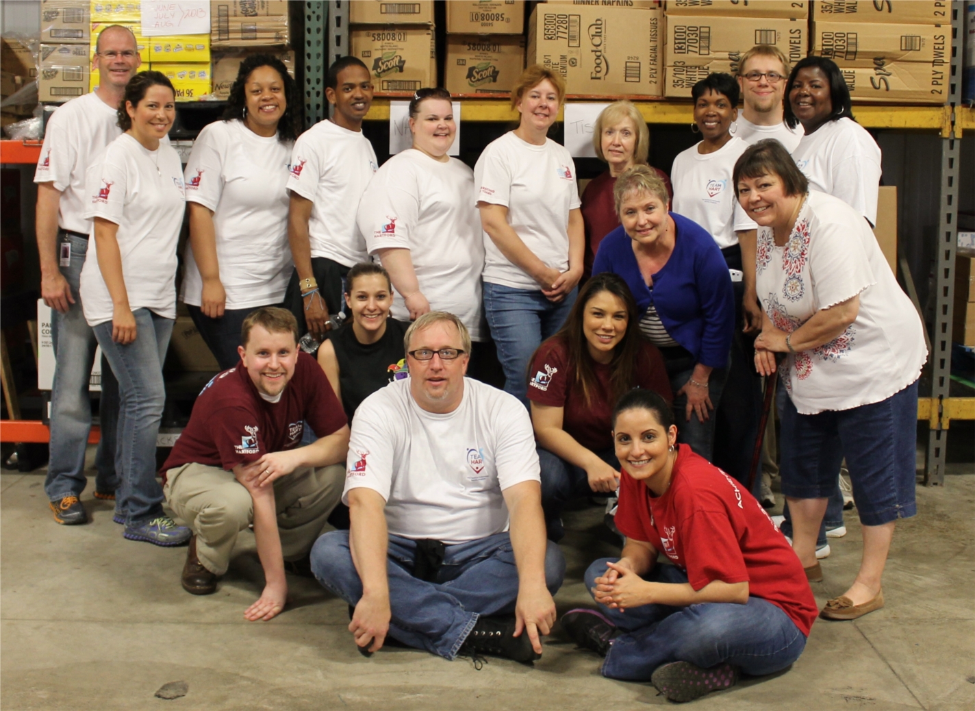 Employees from The Hartford volunteered at Green Harvest in Plainfield, IL to sort food donations and assemble summer lunch boxes for children.