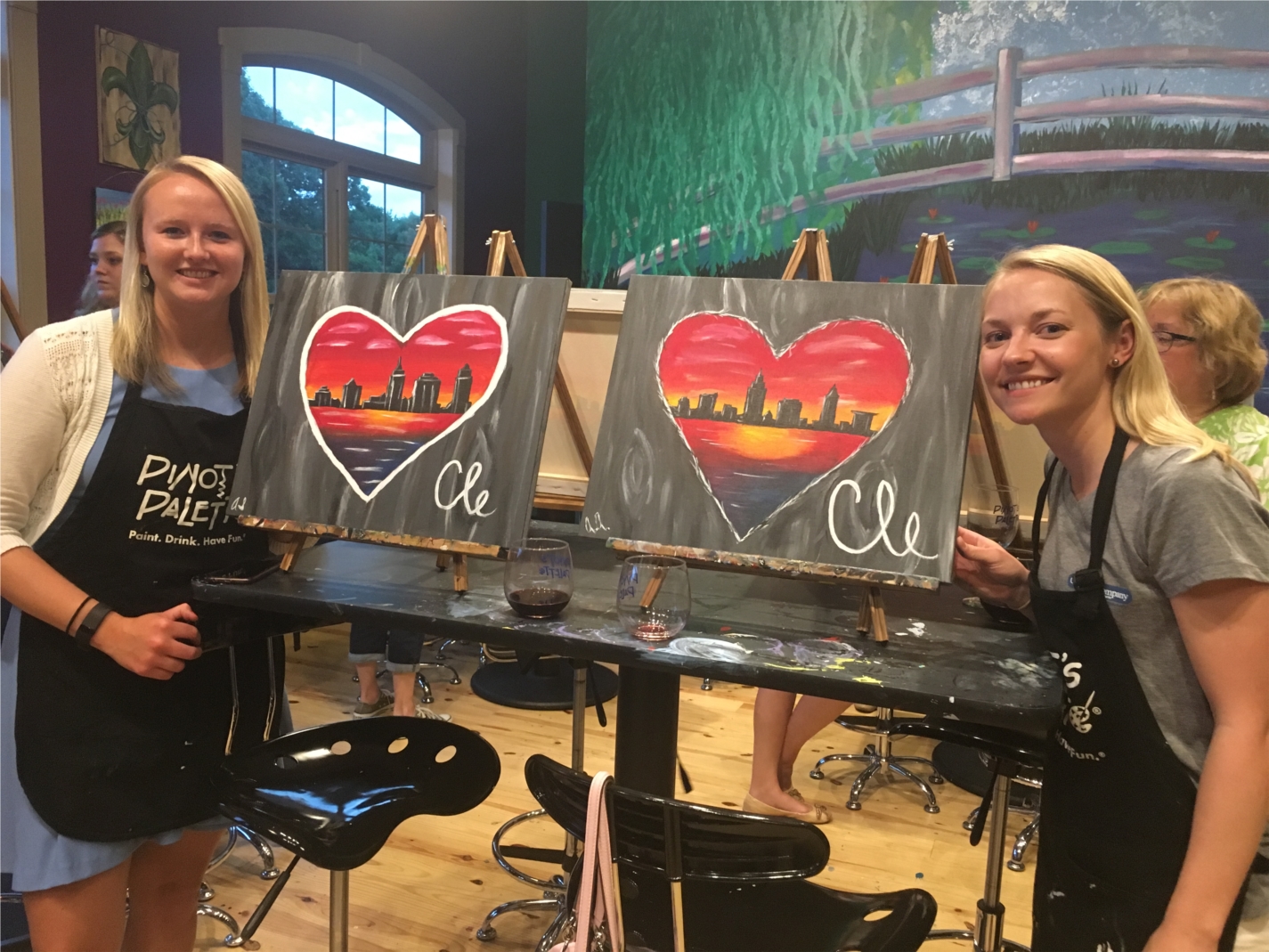 Two of our CNEW (Cohen Network of Empowered Women) participants enjoying a paint night event to network with their peers in the firm.