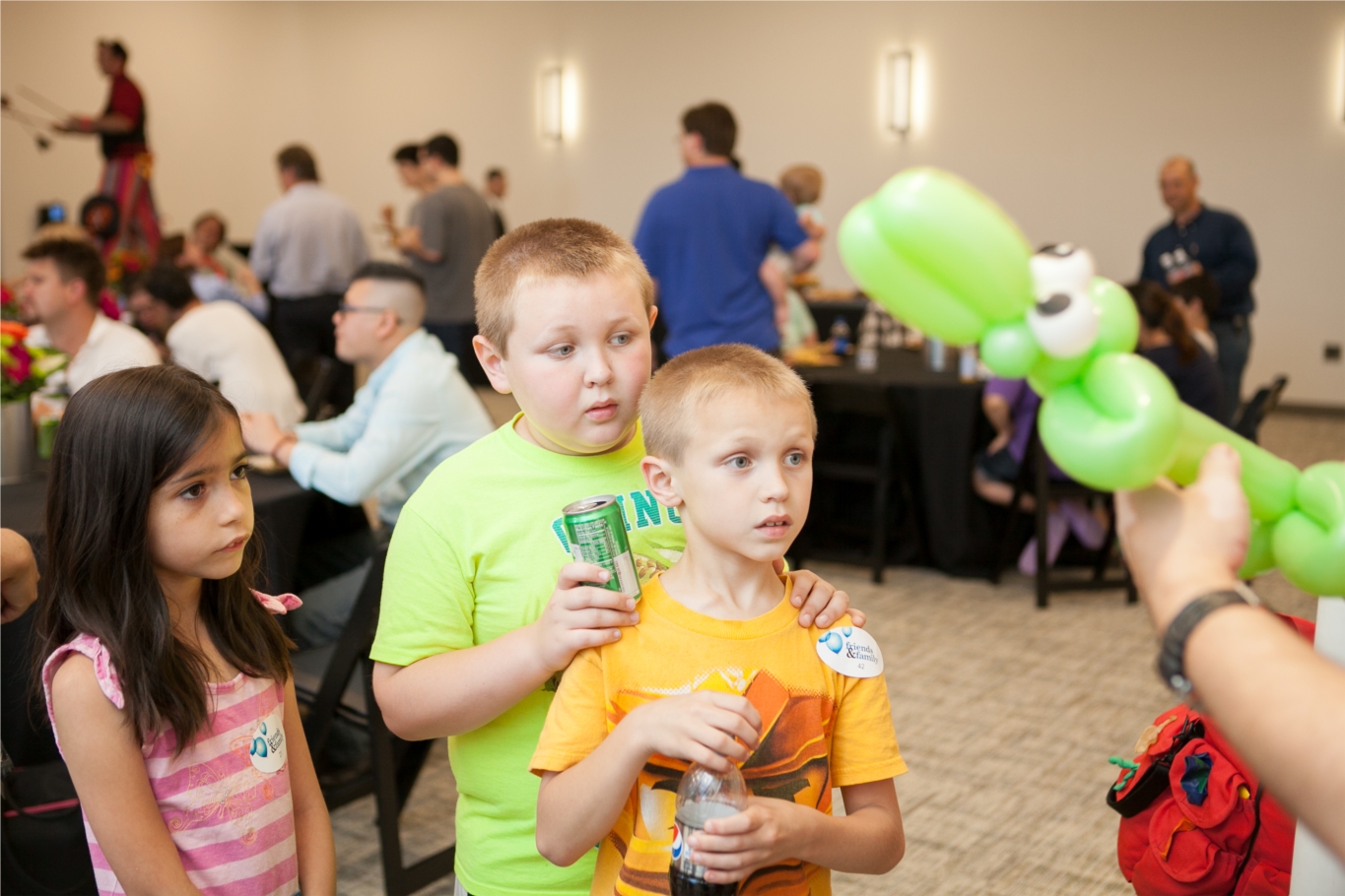 Employees' children enjoy ballon making at our annual family event.