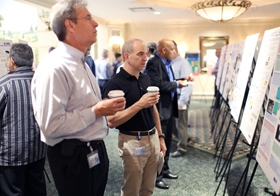 ASML Engineers review posters at Technology Conference