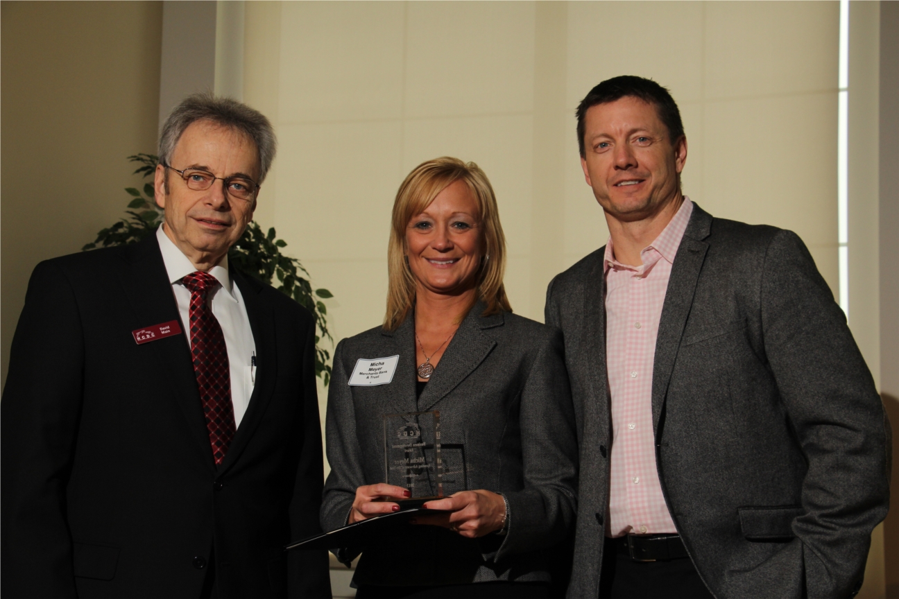 Micha Meyer accepting the "Lending Advocate of the Year" award at the Hamilton County Development Company awards meeting.  