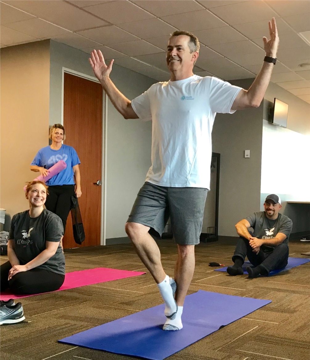 Health Carousel CEO, Bill DeVille doing on-site yoga with employees. #AchieveMoreLiveMore