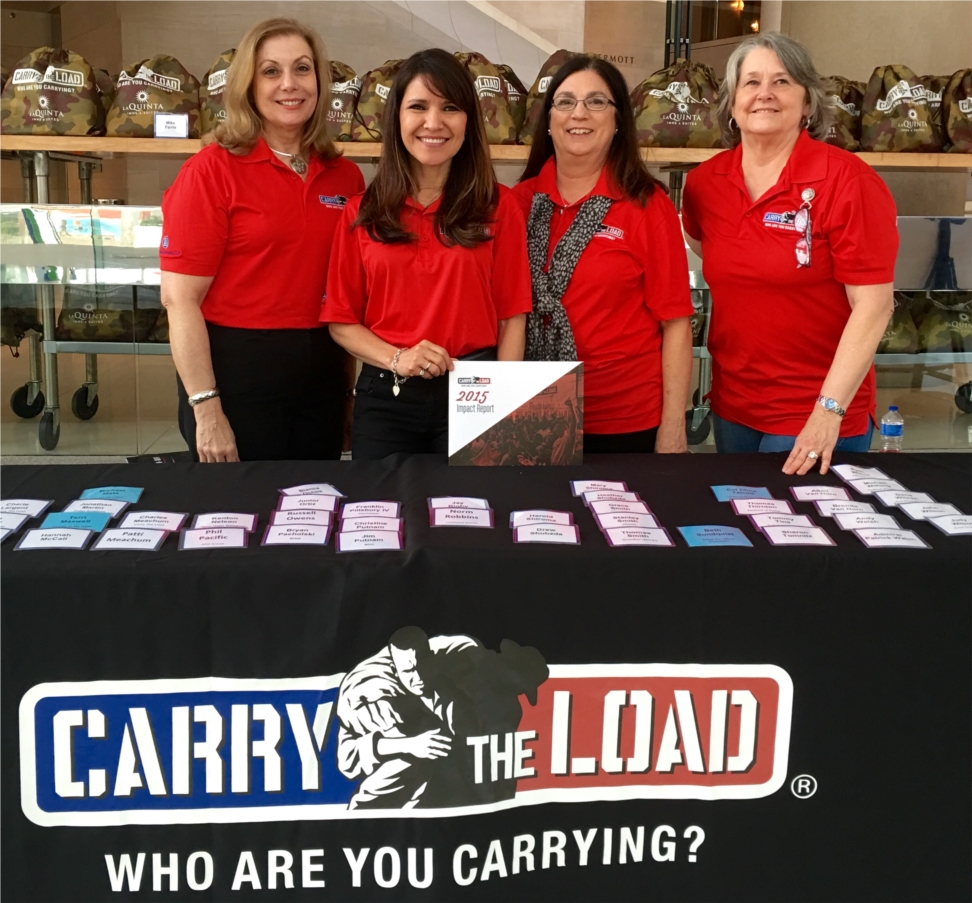 Our employees working the check-in table for Carry The Load's kick-off event. 