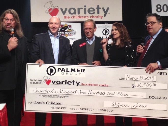 David Leto presenting a check to the Variety - Children's Charity. 