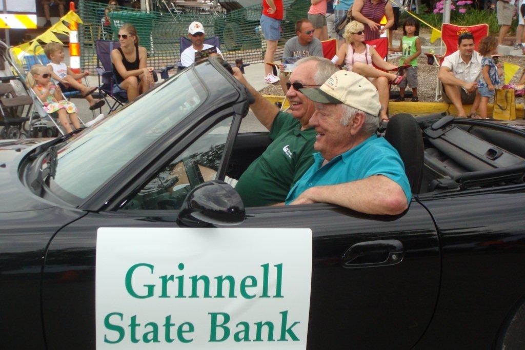 Branch Manager and Chairman of the Board representing Grinnell State Bank in the 2015 Four Seasons Parade in Polk City. 