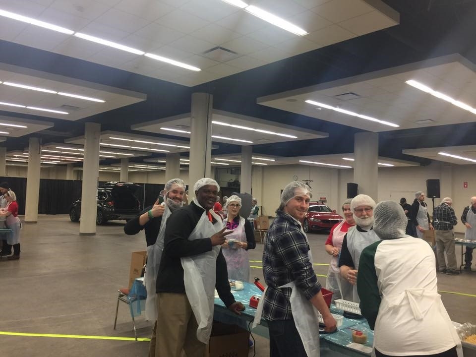 The team from BMW of Des Moines volunteering for Tame the Hunger, Polk County.