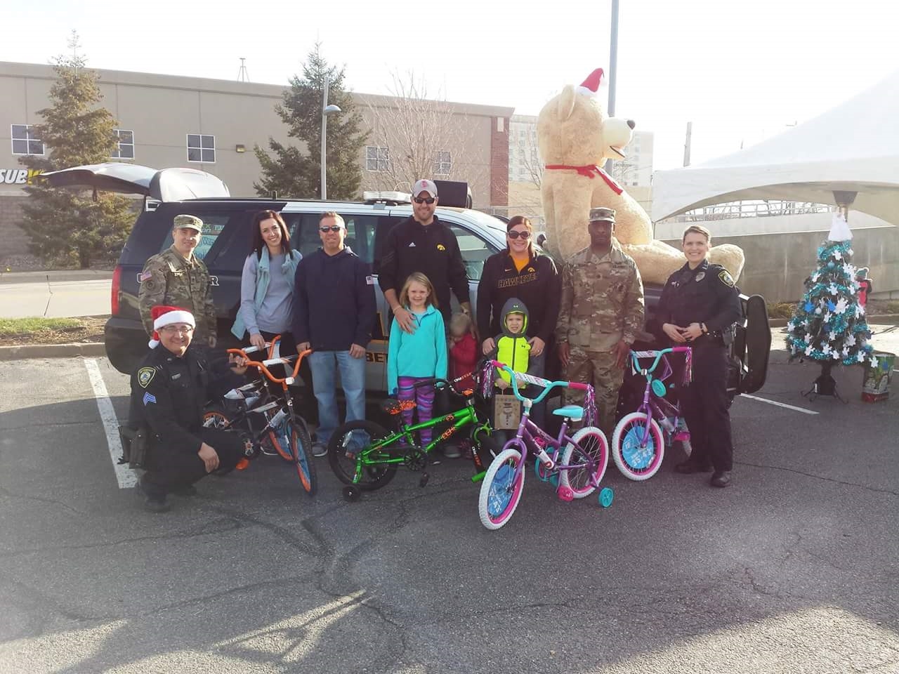 Officers in the Bettendorf Police Department deliver donations collected for Operation Toy Soldier. 