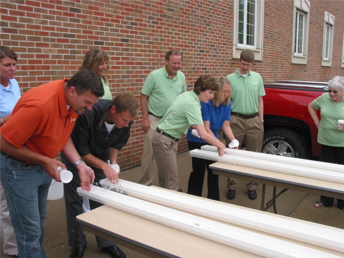 Employees competing in minnow races.