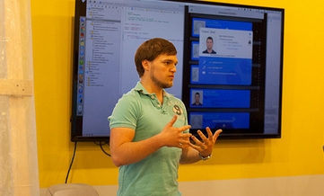 Jared Dickson, an OST application developer, presents a demo of a recent project at "Demo Days" where employees compete for a coveted trophy and bragging rights. This is a great way to highlight client success stories, share best practices, and also hone presentation skills. 