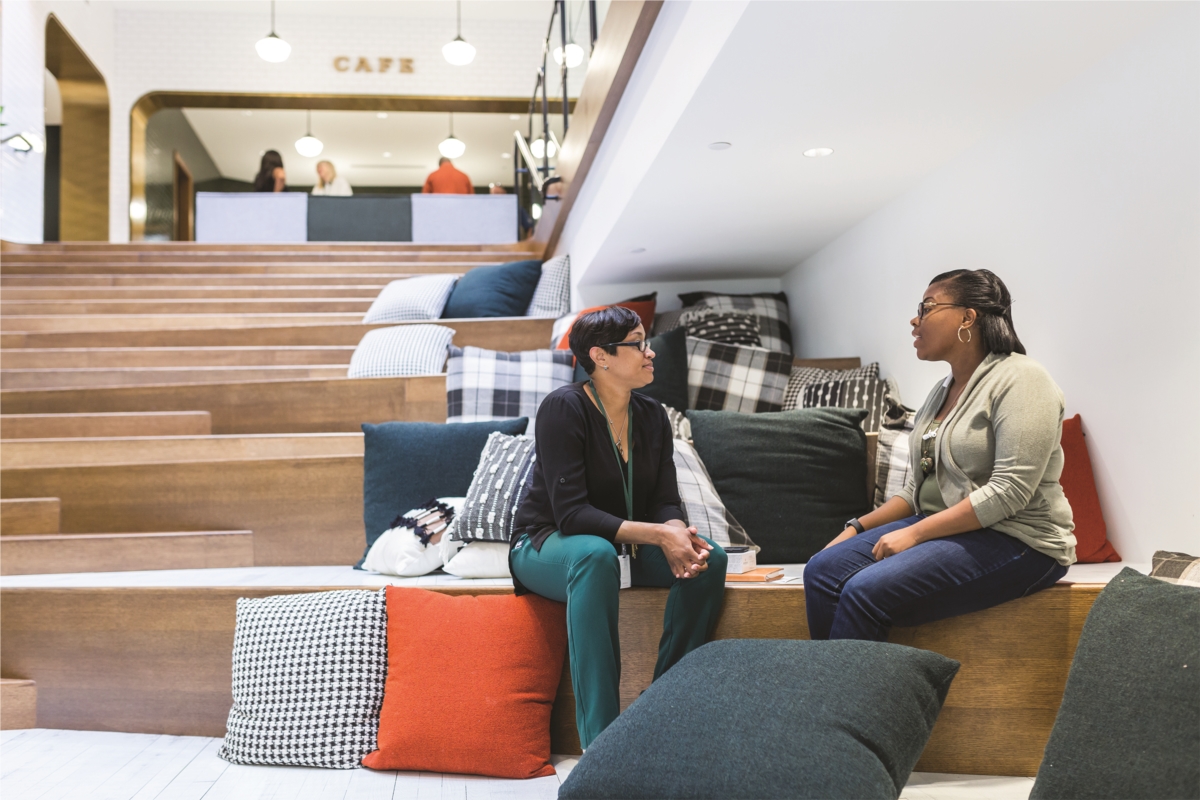 Team Members meeting on the grand staircase in our beautiful new headquarters.