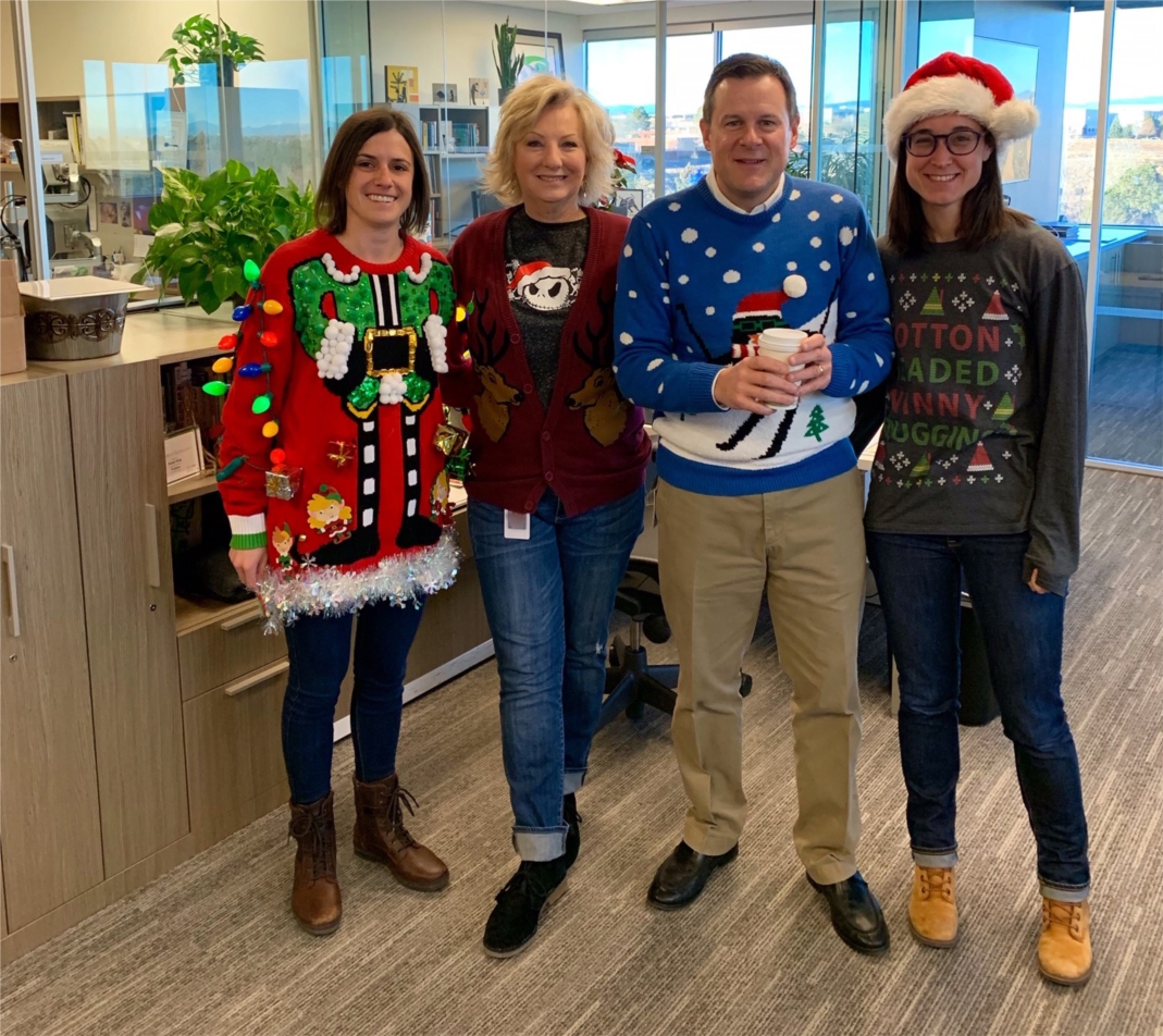 Employees displaying their ugly sweaters for our 5th Annual Ugly Sweater Contest.