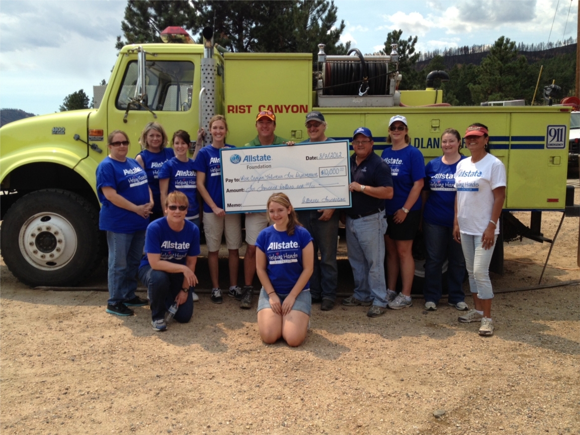Allstate employees and agents present a $10,000 check to the Rist Canyon Volunteer Fire Department