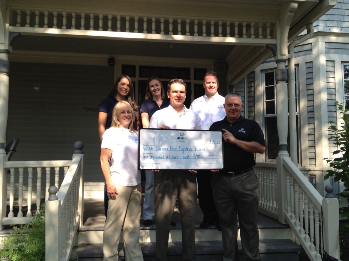 Allstate employees and agents present a $10,000 check to the Waldo Canyon Fire Fighters Fund