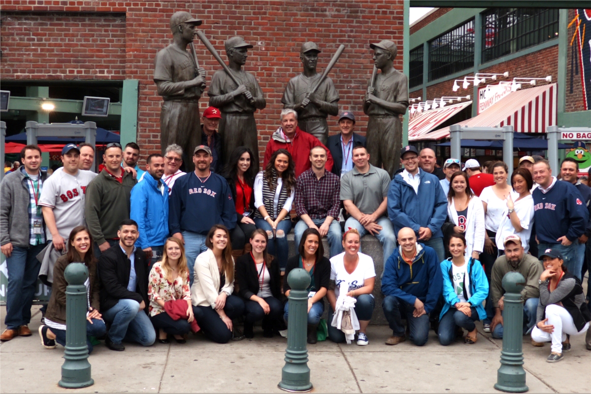 Hanover employees gather for an event at Fenway Park to watch the Astros take on the Red Sox.