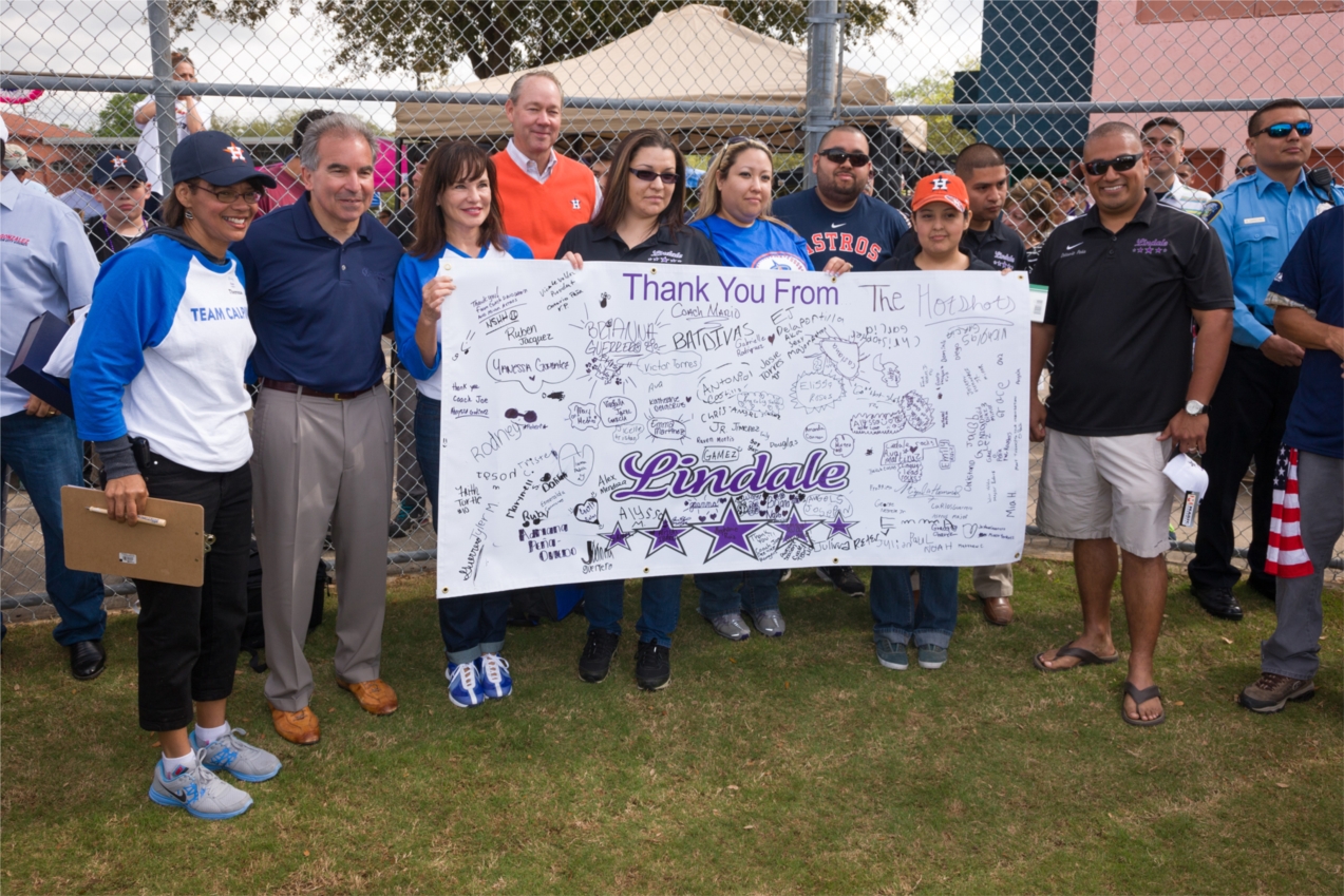 Calpine volunteers celebrated opening day of the 2013 Lindale Little League baseball season with a dedication at Moody Park, where Calpine helped revitalize ball fields as part of the Community Leaders program with the Houston Astros and the City of Houston.  Employees distributed batting helmets and equipment bags to nearly 200 young players.  Pictured (beginning second from left) are Calpine Chief Executive Officer Jack Fusco, Calpine Vice President of Corporate Communications Norma Dunn and Astros Chairm