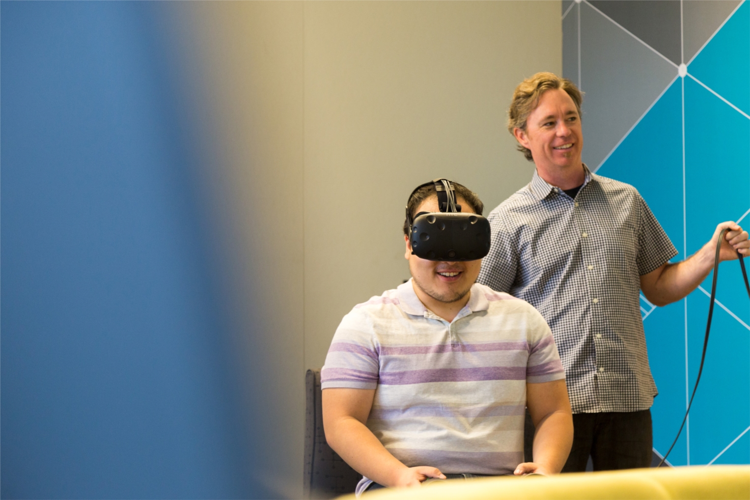 Two HMC Ontario employees experience a virtual reality demo led by our in-house visualization team.