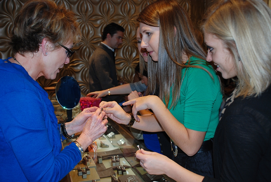 Jewelry Consultant Shirley Wagner (left) showing engagement rings to members of the Colts Women’s Organization at a private event.