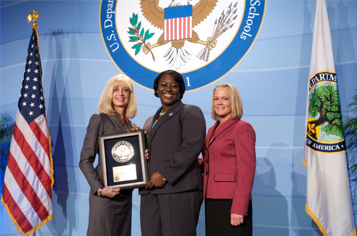 Fishers Elementary Principal Patty Bittenger (left) Mansfield and teacher Kerri Rhodes (right) accept a national Blue Ribbon award in Washington, D.C.