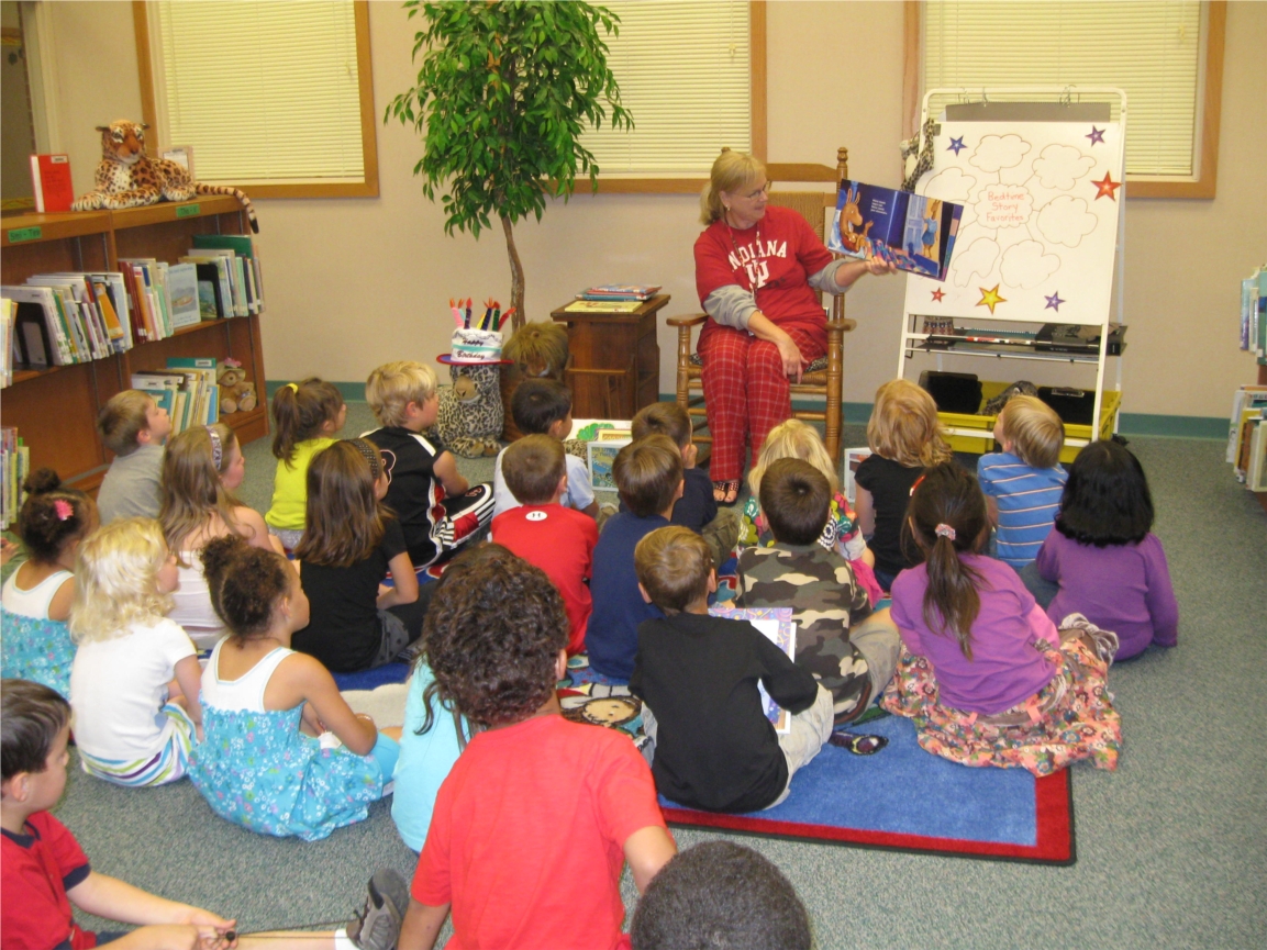 Lantern Road Elementary's Media Specialist Lori Silbert shares a book with a class during a Read for the Records event.