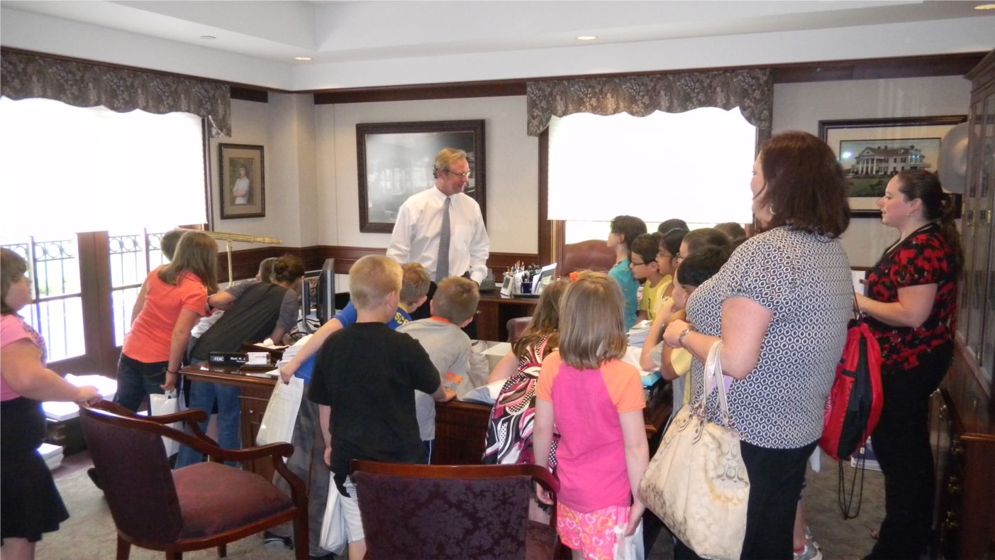 American Bank believes that it's never too early to start teaching children to save.  President and CEO Mark Jaindl teaches children from a local elementary school about banking.