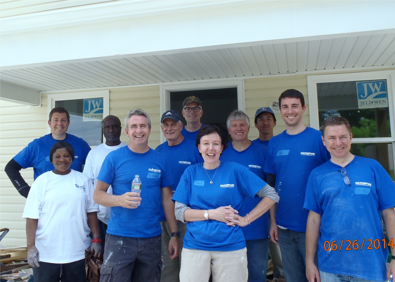 Olympus executives help Habitat for Humanity build a house in Bethlehem.