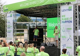 Don Hendler, CEO (right) and Daryoush Larizadeh, President and COO (left) on stage welcoming employees to the Leviton Brand Rally event. 