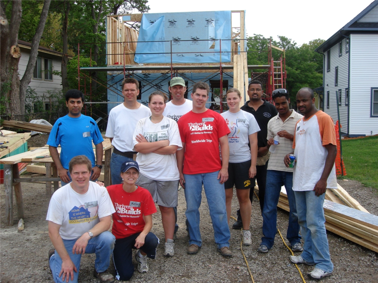 Thrivent employees volunteer with others at a Thrivent Builds with Habitat for Humanity home.