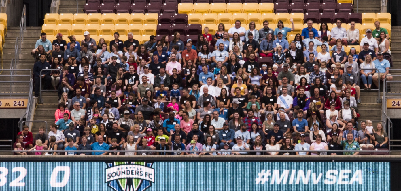 WSB staff cheering on the MN United at the annual summer picnic. 