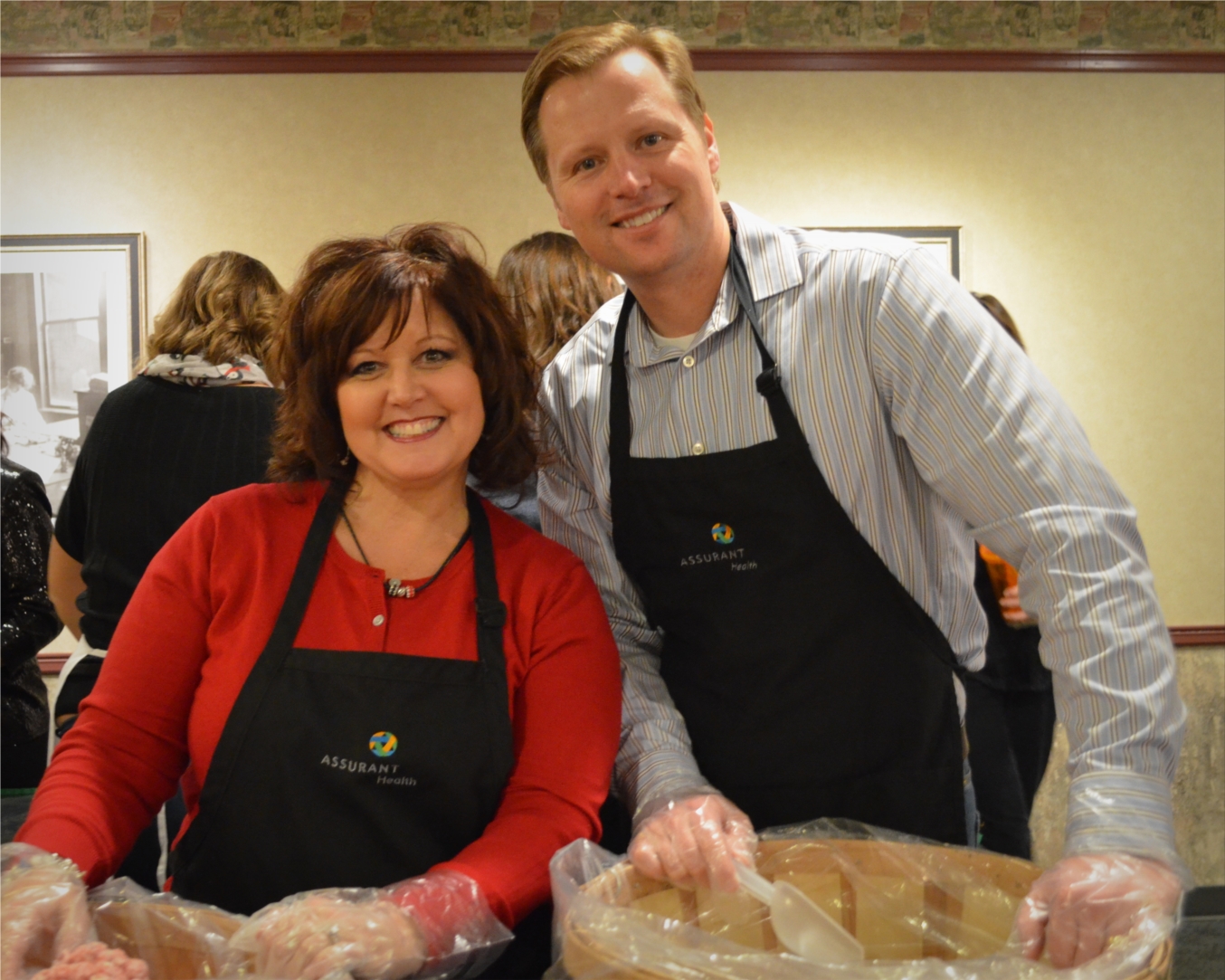 Assurant Health leaders host a gourmet popcorn bar for employees at the company’s annual holiday reception. From left: Pam Entringer, Jim Frelka