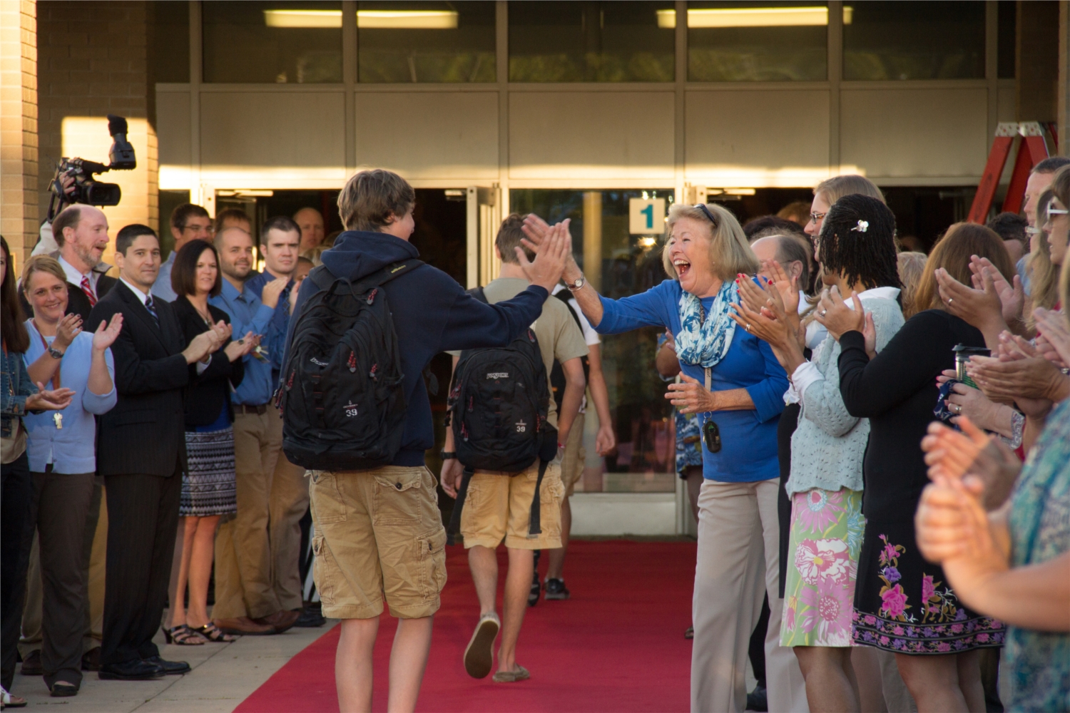 Nicolet High School staff members welcome students back to school annually on the red carpet.